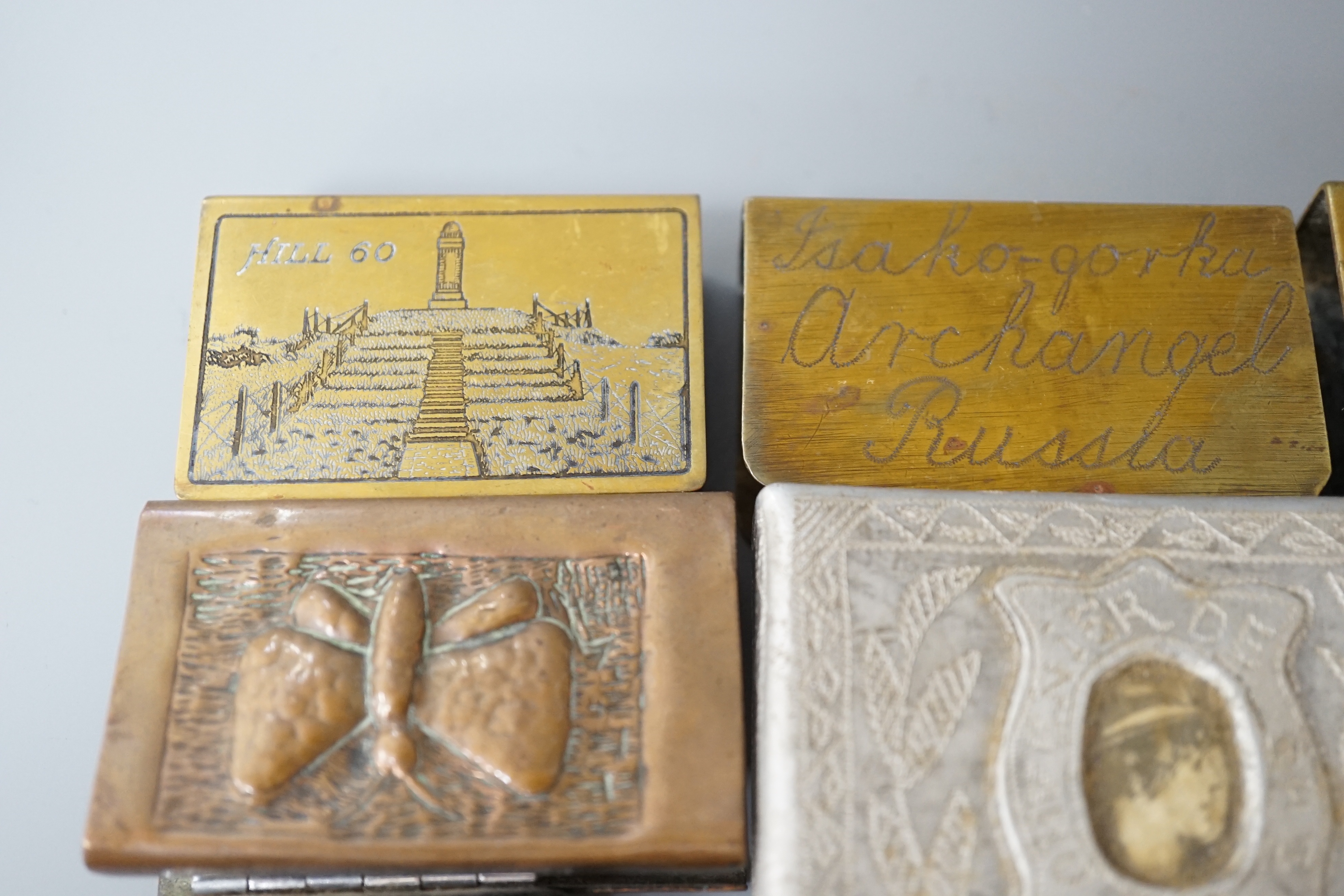 A collection of trench art and military vestas and matchbox holders